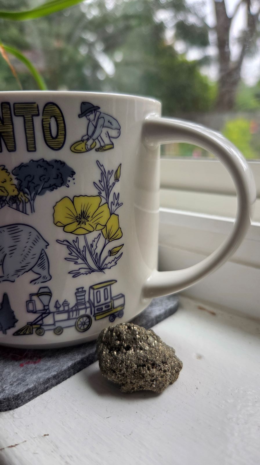 fools gold chunk and a coffee cup with Sacramento symbols